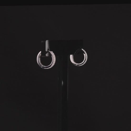 360 degree video of the pavé natural diamond huggie hoop earrings in 14K white gold