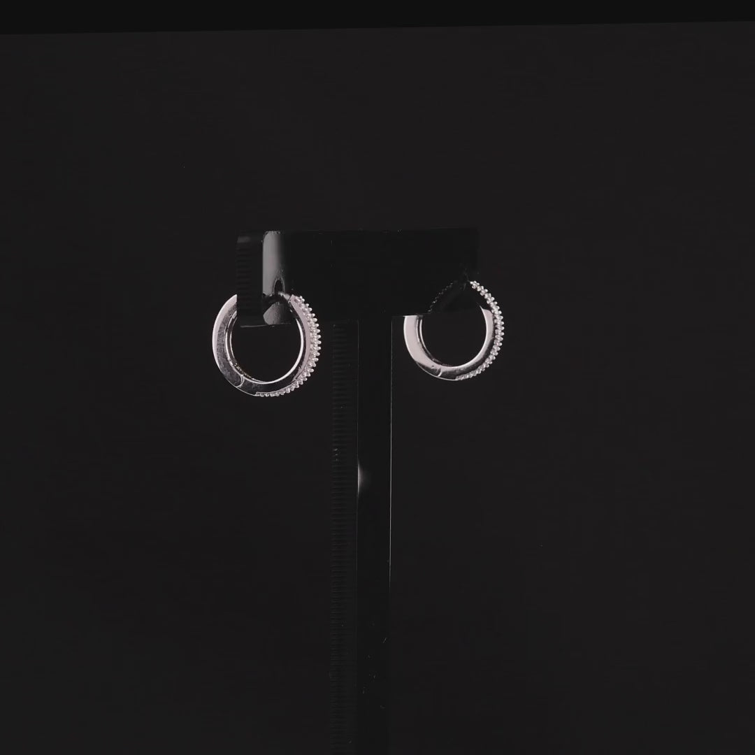 360 degree video of the pavé natural diamond huggie hoop earrings in 14K white gold