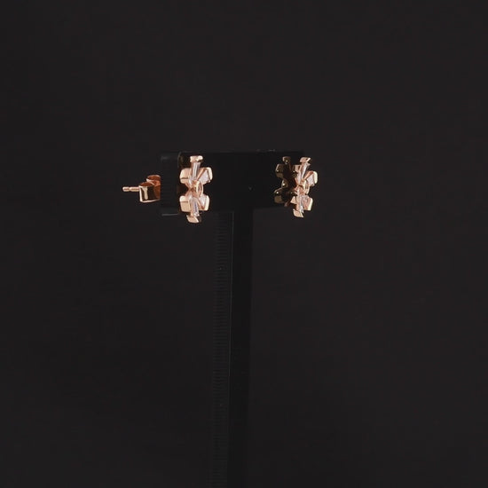 360-degree video of the tapered baguette natural diamond flower stud earrings in 18K rose gold