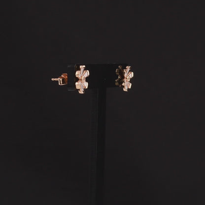 360-degree video of the tapered baguette natural diamond flower stud earrings in 18K rose gold