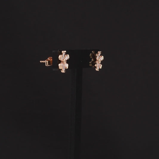 360-degree video of the tapered baguette natural diamond flower stud earrings in 18K rose gold