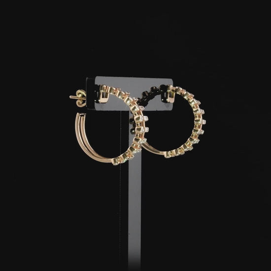 360-degree video of the baguette and round natural diamond hoop earrings in 14K rose gold