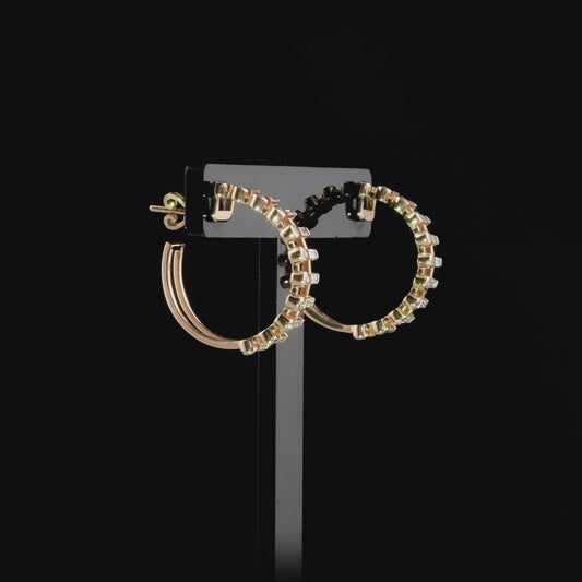 360-degree video of the baguette and round natural diamond hoop earrings in 14K rose gold