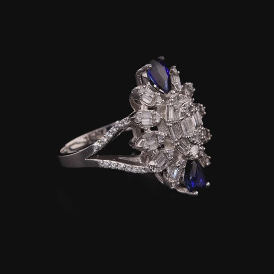 360 degree video of the sapphire and natural diamond baguette starburst cocktail ring in 14K white gold