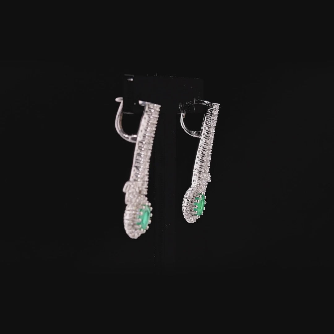 360 degree video of the emerald and natural diamond halo drop earrings in 18K white gold