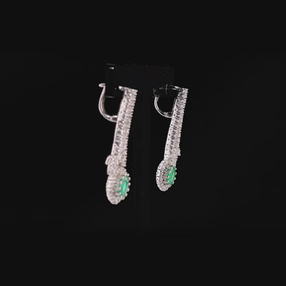 360 degree video of the emerald and natural diamond halo drop earrings in 18K white gold