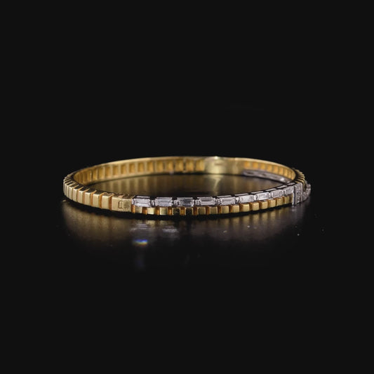 360 degree video of the natural diamond baguette two-tone hinged bangle in 14K yellow and white gold