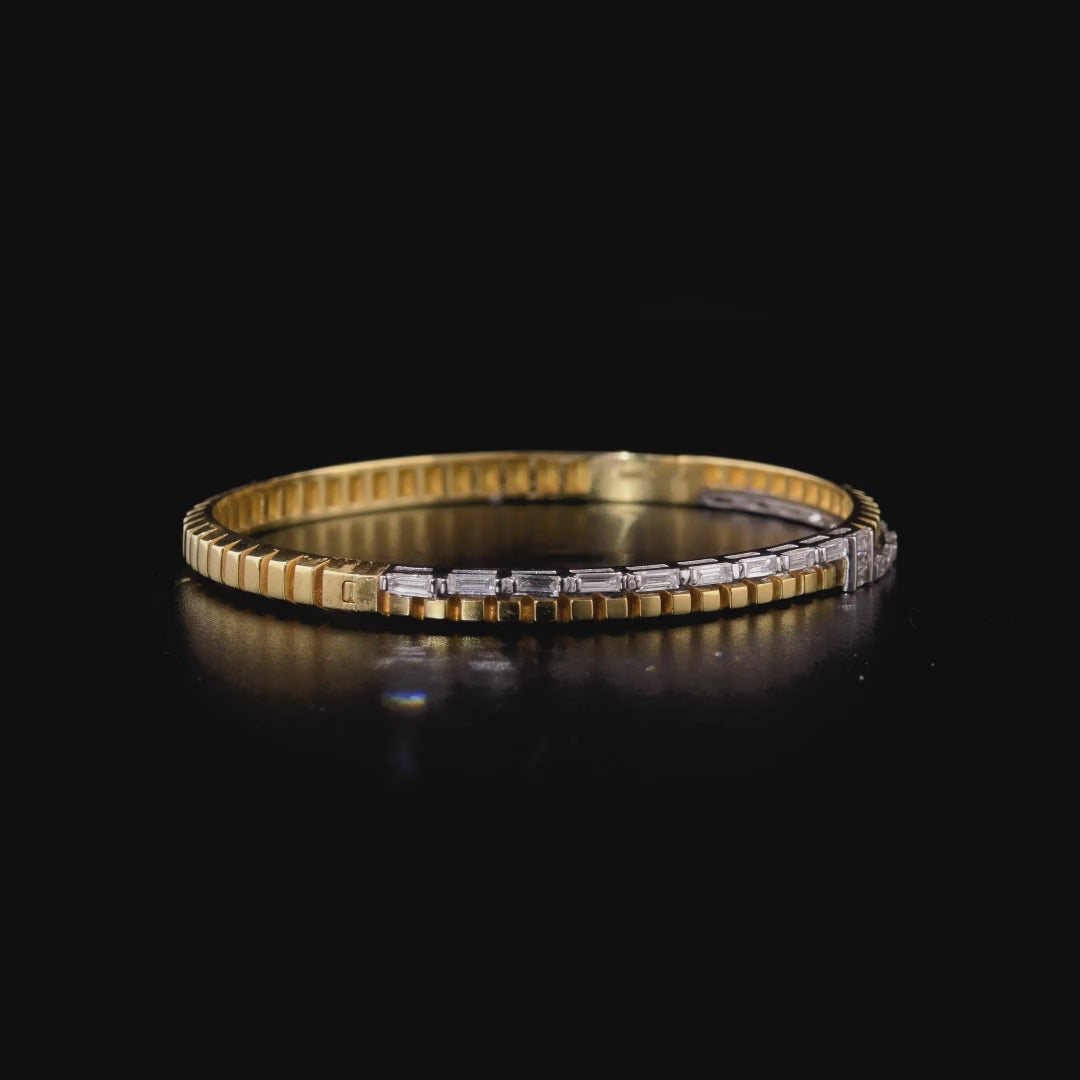 360 degree video of the natural diamond baguette two-tone hinged bangle in 14K yellow and white gold