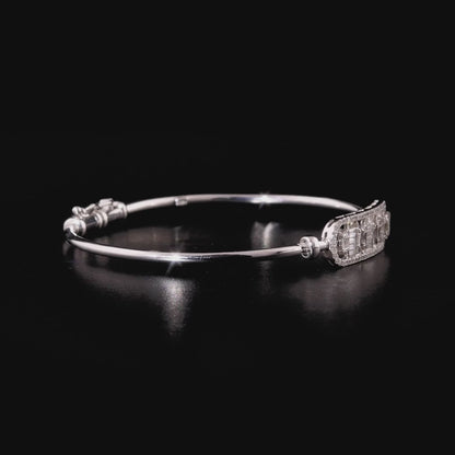 360 degree video of the natural diamond baguette bar hinged bangle in 18K white gold