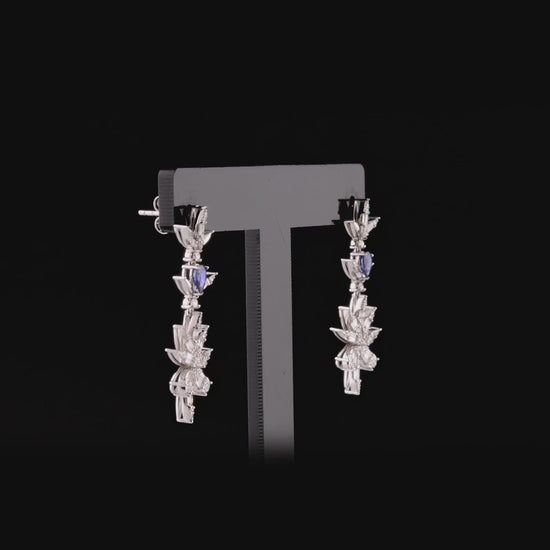 360-degree video of the natural diamond and sapphire flower drop earrings in 14K white gold