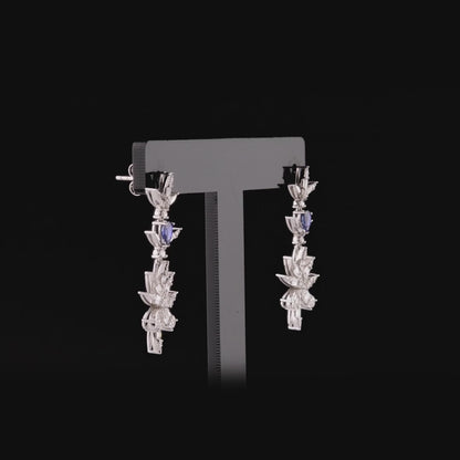 360-degree video of the natural diamond and sapphire flower drop earrings in 14K white gold