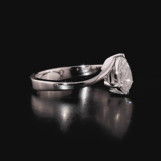 360 degree video of the pear-cut natural diamond bypass solitaire ring in 14K solid white gold