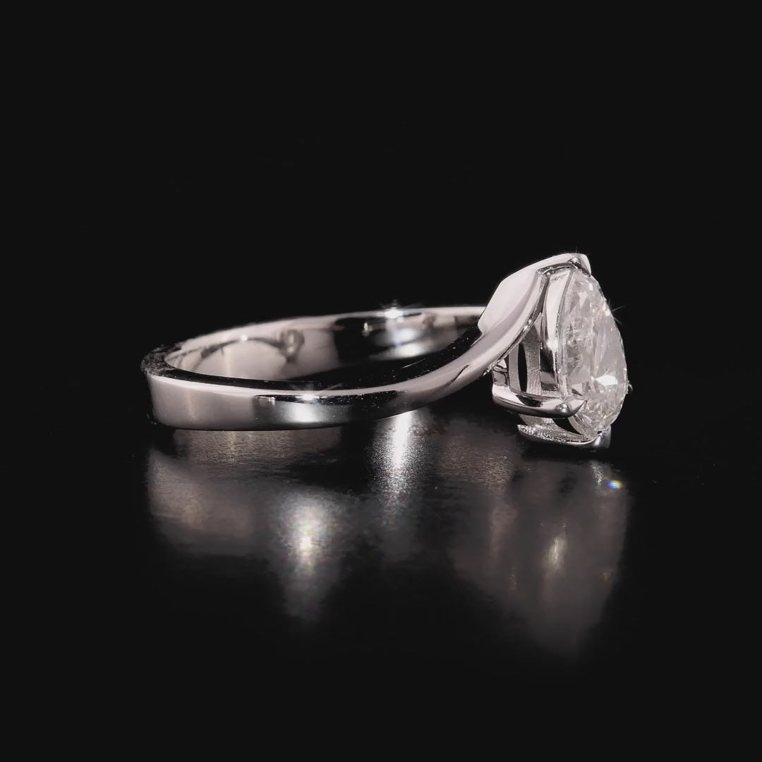 360 degree video of the pear-cut natural diamond bypass solitaire ring in 14K solid white gold