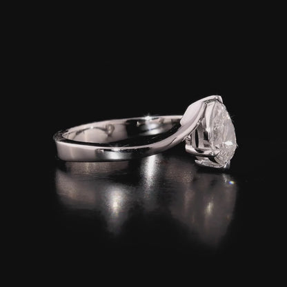 360 degree video of the pear-cut natural diamond bypass solitaire ring in 14K solid white gold