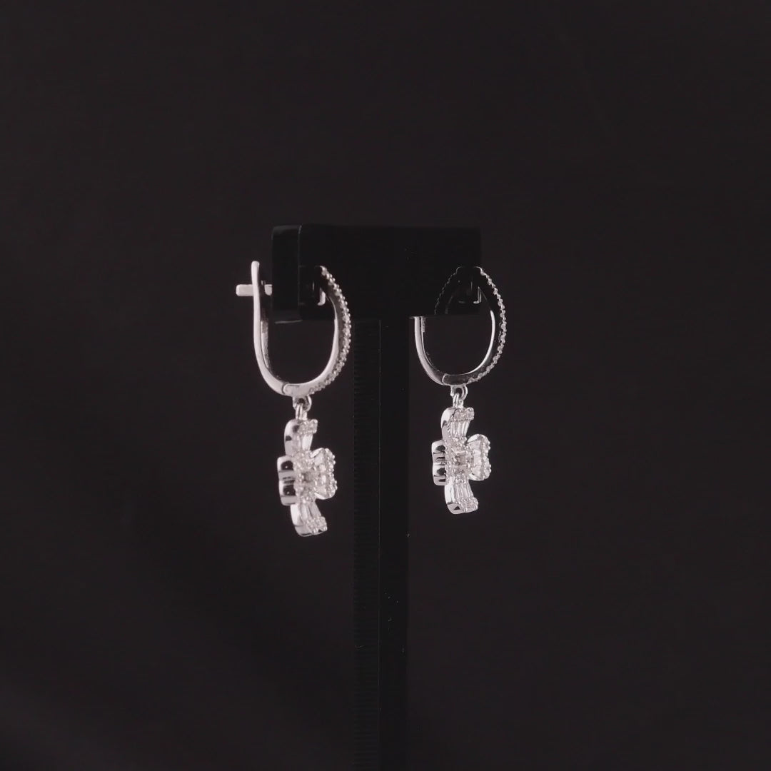 360 degree video of the natural diamond clover drop huggie earrings in 18K white gold