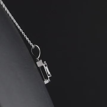 Baguette diamond halo pendant in 14K white gold turning 360 degrees