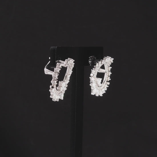 360-degree video of the natural diamond marquise and baguette open circle earrings in 14K white gold.