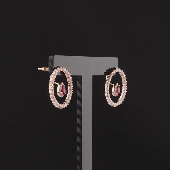 360 degree video of the ruby and natural diamond open circle earrings in 14K rose gold