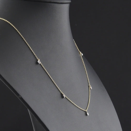 360 degree video of the natural diamond bezel drop station necklace in 14K yellow and white gold