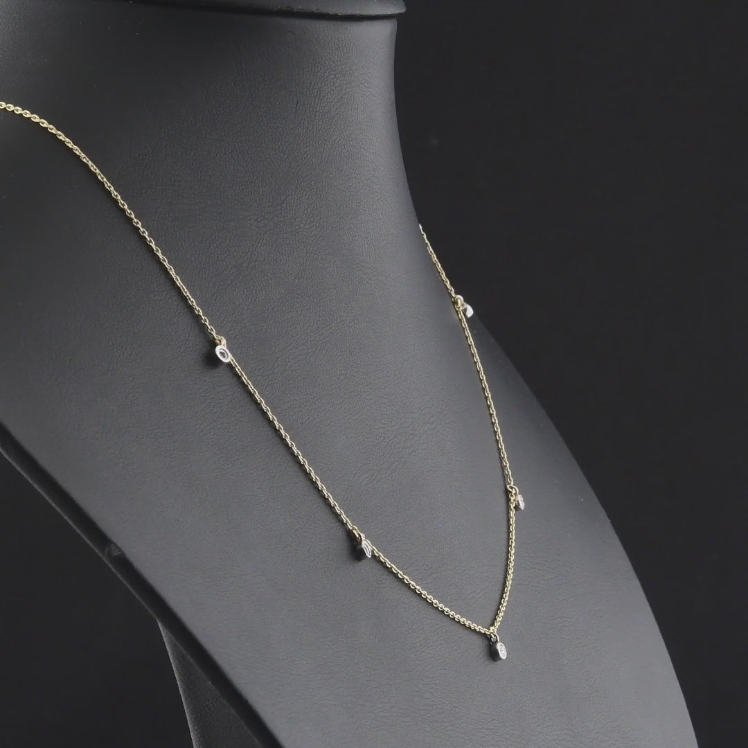 360 degree video of the natural diamond bezel drop station necklace in 14K yellow and white gold