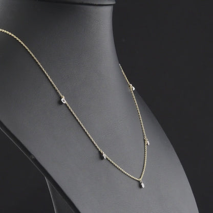360 degree video of the natural diamond bezel drop station necklace in 14K yellow and white gold