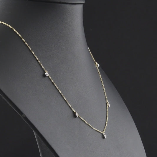 360 degree video of the natural diamond bezel drop station necklace in 14K yellow and white gold