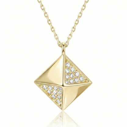 Pyramid pendant necklace in 14K solid gold, with small clear CZ stones set on two of its four faces.