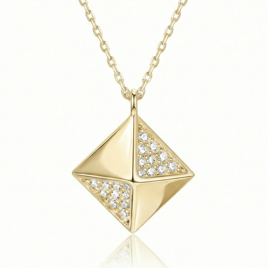 Pyramid pendant necklace in 14K solid gold, with small clear CZ stones set on two of its four faces.