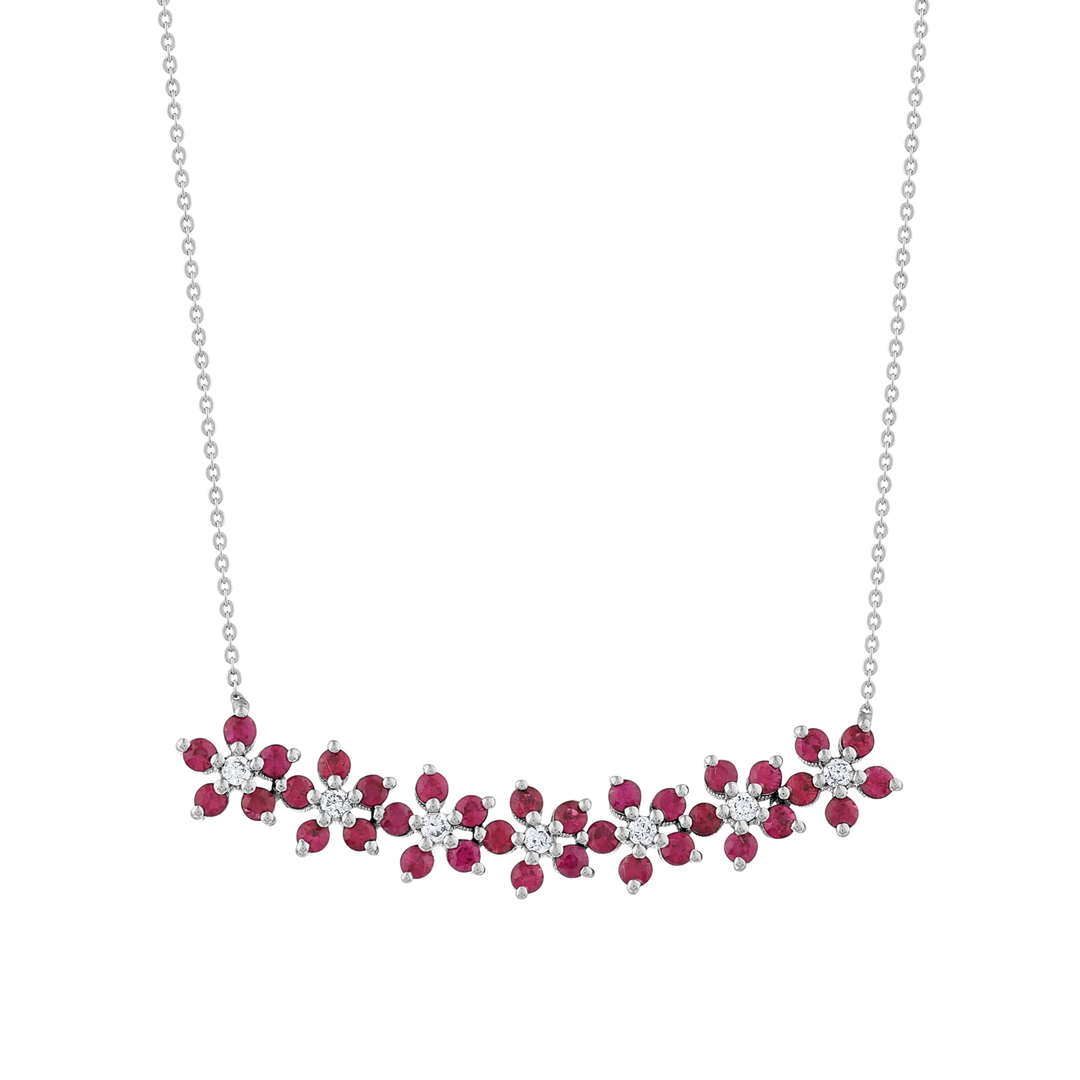 Close-up of the seven ruby flowers with natural diamond centres in 14K white gold
