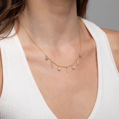Close detail of the Satellite Charm Necklace in 18K Gold Vermeil. Safe for sensitive skin, premium handmade jewelry.