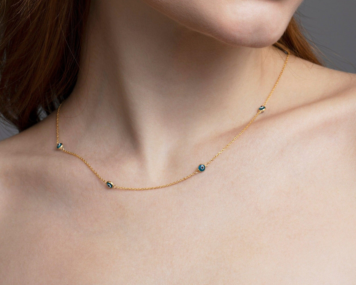 The Satellite Evil Eye Necklace Chain worn in 18K Gold Vermeil — refined accessory for women. Hypoallergenic, no green marks.