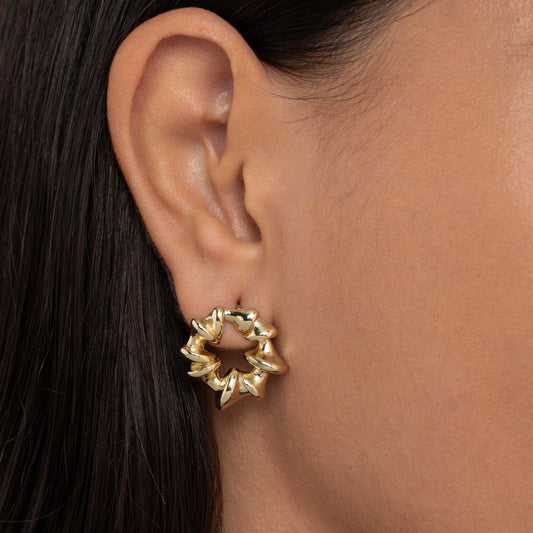 Close detail of the Sculpted Spiked Hoop Earrings in Gold-Plated Steel. Tarnish-resistant, premium handmade jewelry.