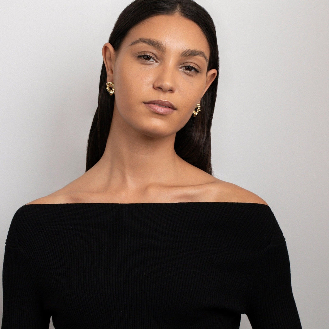 The Sculpted Spiked Hoop Earrings styled in Gold-Plated Steel — elegant everyday jewelry. Hypoallergenic for sensitive ears.