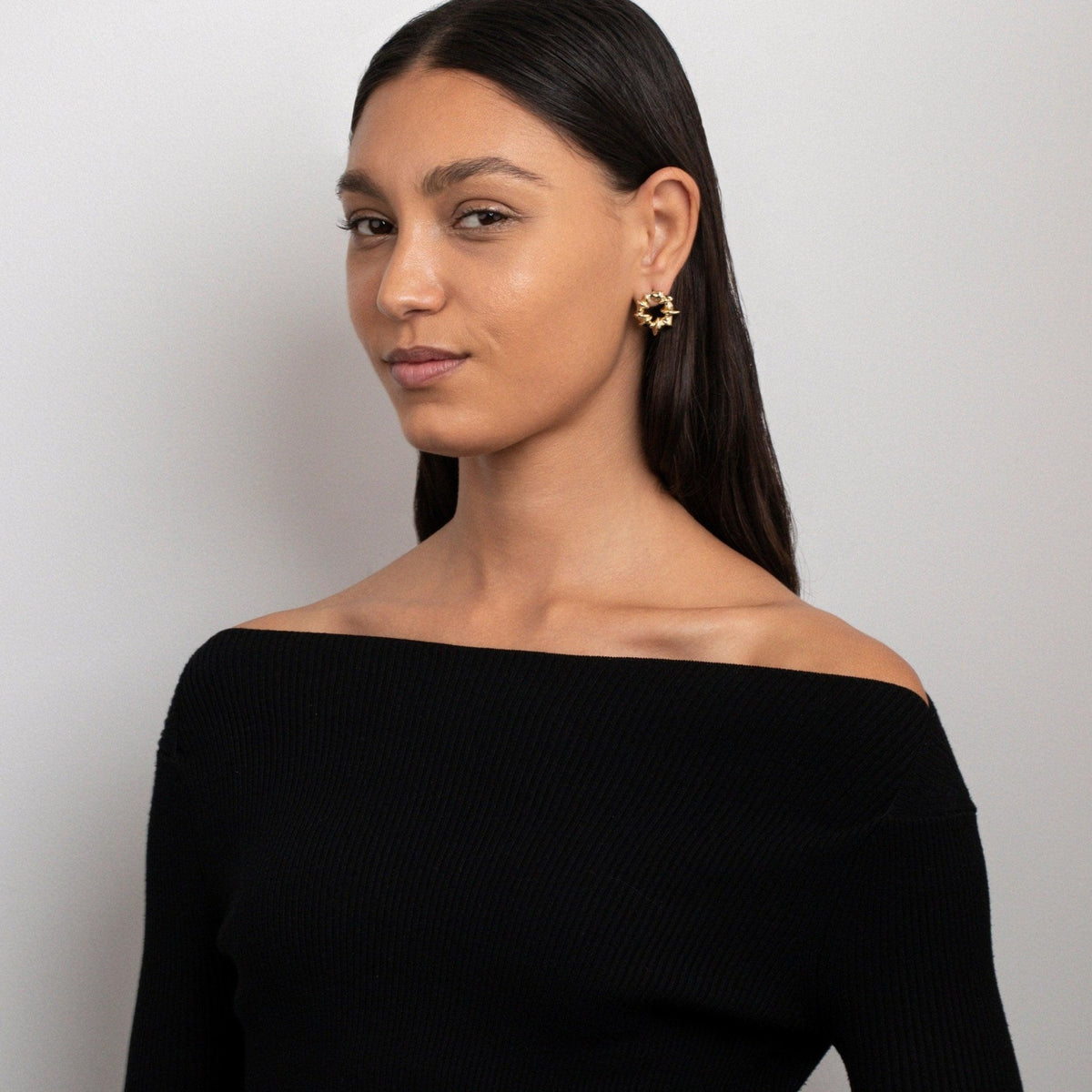 The Sculpted Spiked Hoop Earrings as an anniversary gift in Gold-Plated Steel. Tarnish-resistant, made for keeping.