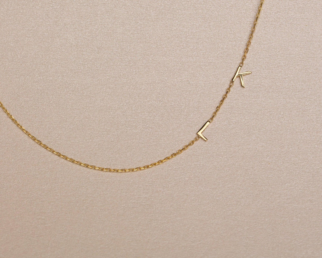 Macro detail of the Sideways Initial Necklace showcasing craftsmanship in 18K Gold Vermeil. Tarnish-resistant, handmade.