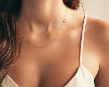 The Sideways Initial Necklace styled in 18K Gold Vermeil — elegant everyday jewelry. Hypoallergenic, no green marks.