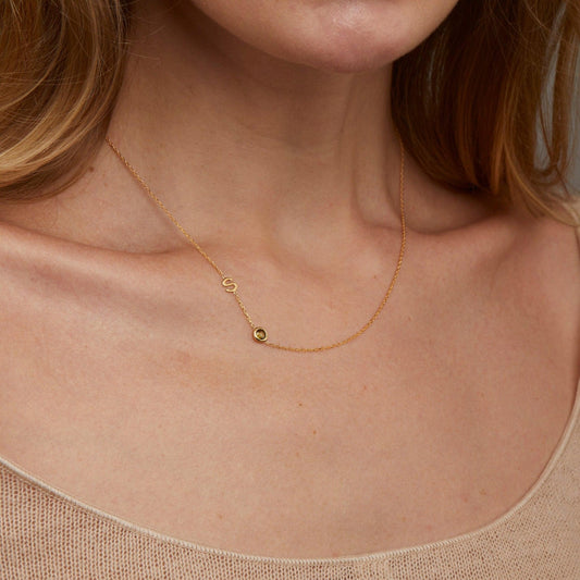 Close detail of the Sideways Initial Necklace with Birthstone in 18K Gold Vermeil with Birthstone. Safe for sensitive skin.