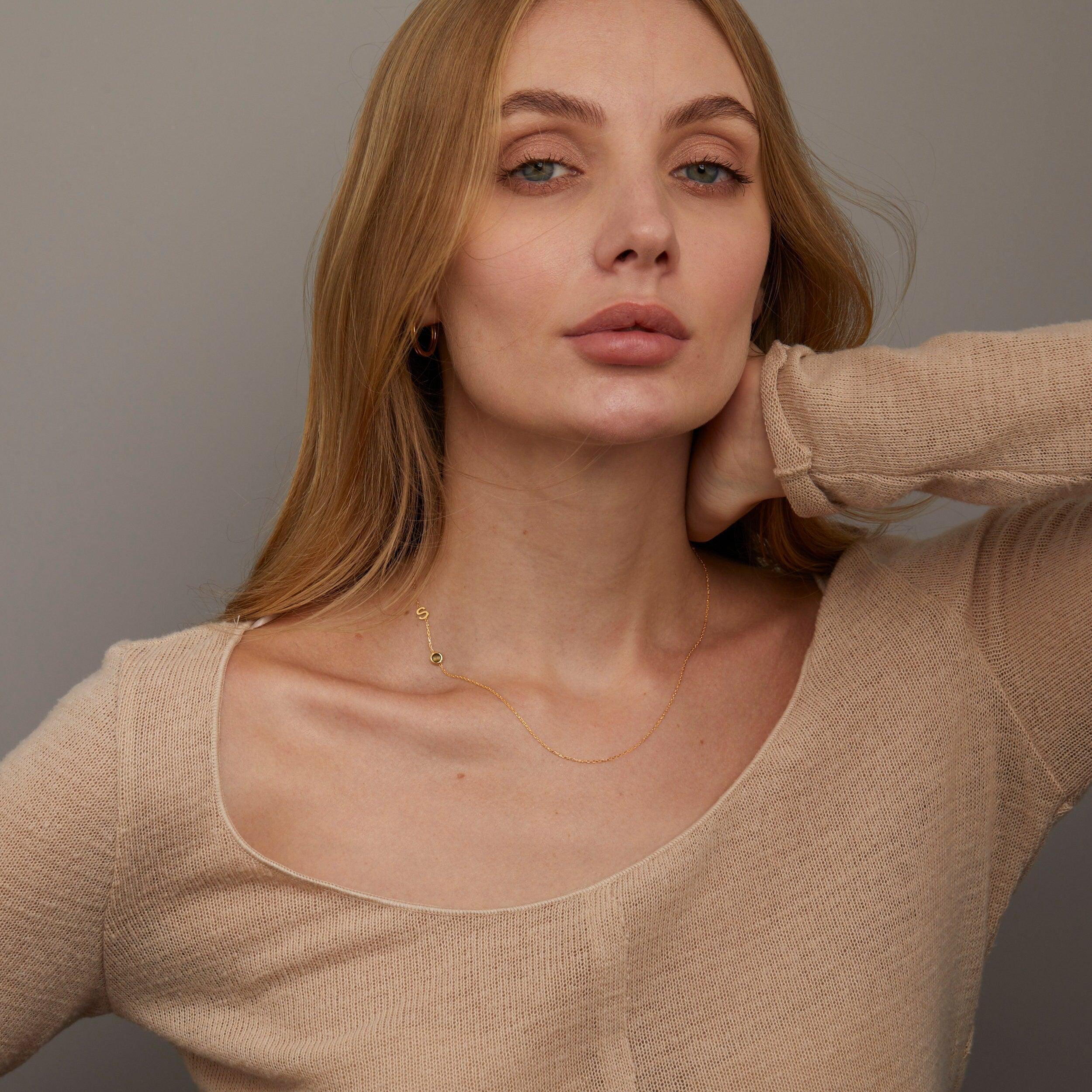 The Sideways Initial Necklace with Birthstone styled in 18K Gold Vermeil — elegant everyday jewelry. Hypoallergenic, no.