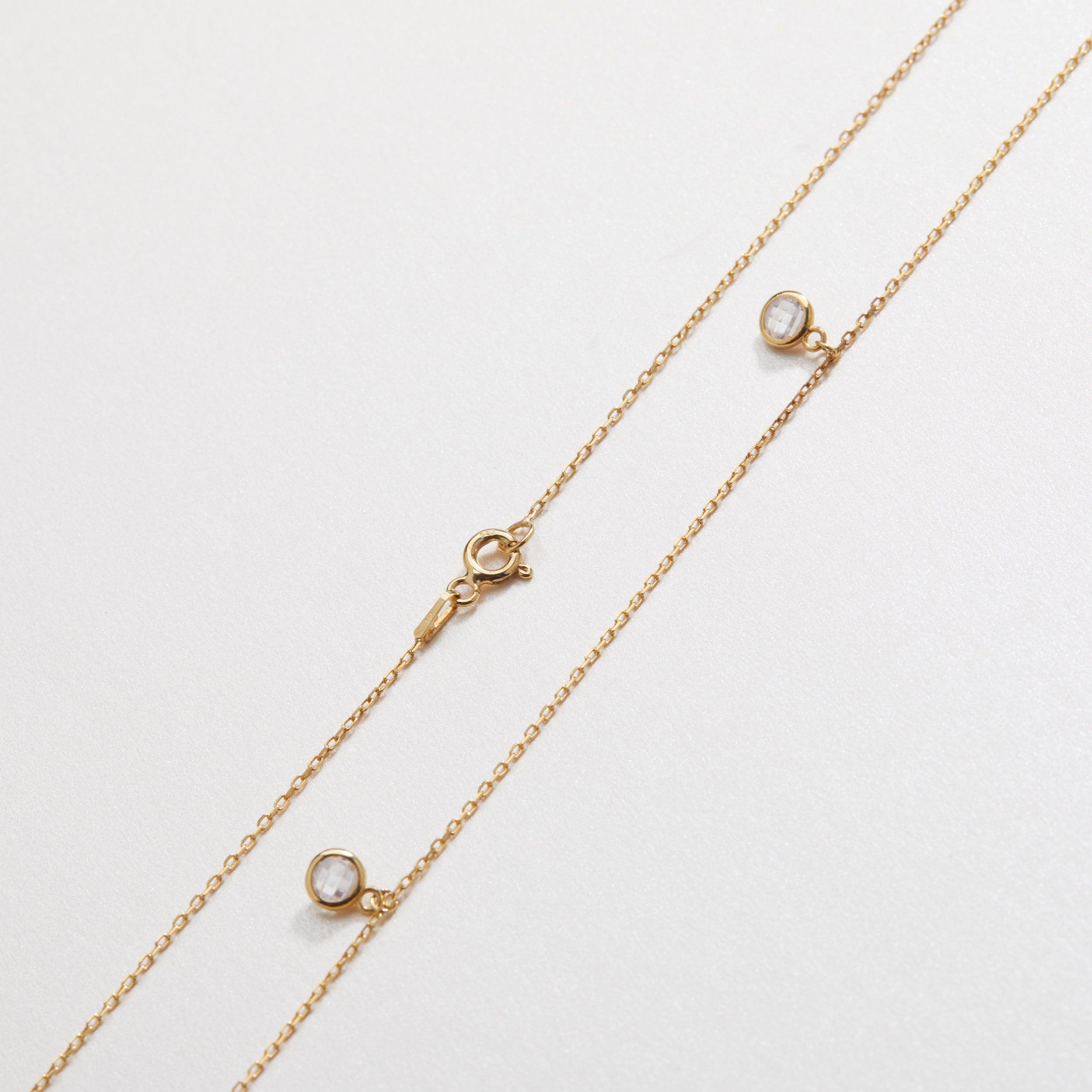 The Silver Satellite Necklace worn in 18K Gold Vermeil — refined accessory for women. Safe for sensitive skin.