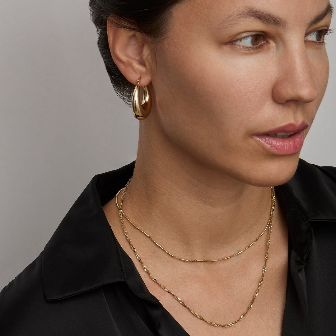 Gold Singapore chain necklace at collarbone length