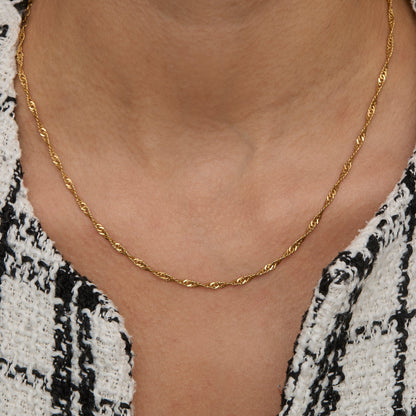 Gold Singapore chain necklace worn on the neck