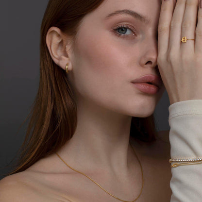 Small Huggie Hoops Earrings as a thoughtful birthday gift in 18K Gold Vermeil. Hypoallergenic for sensitive ears.