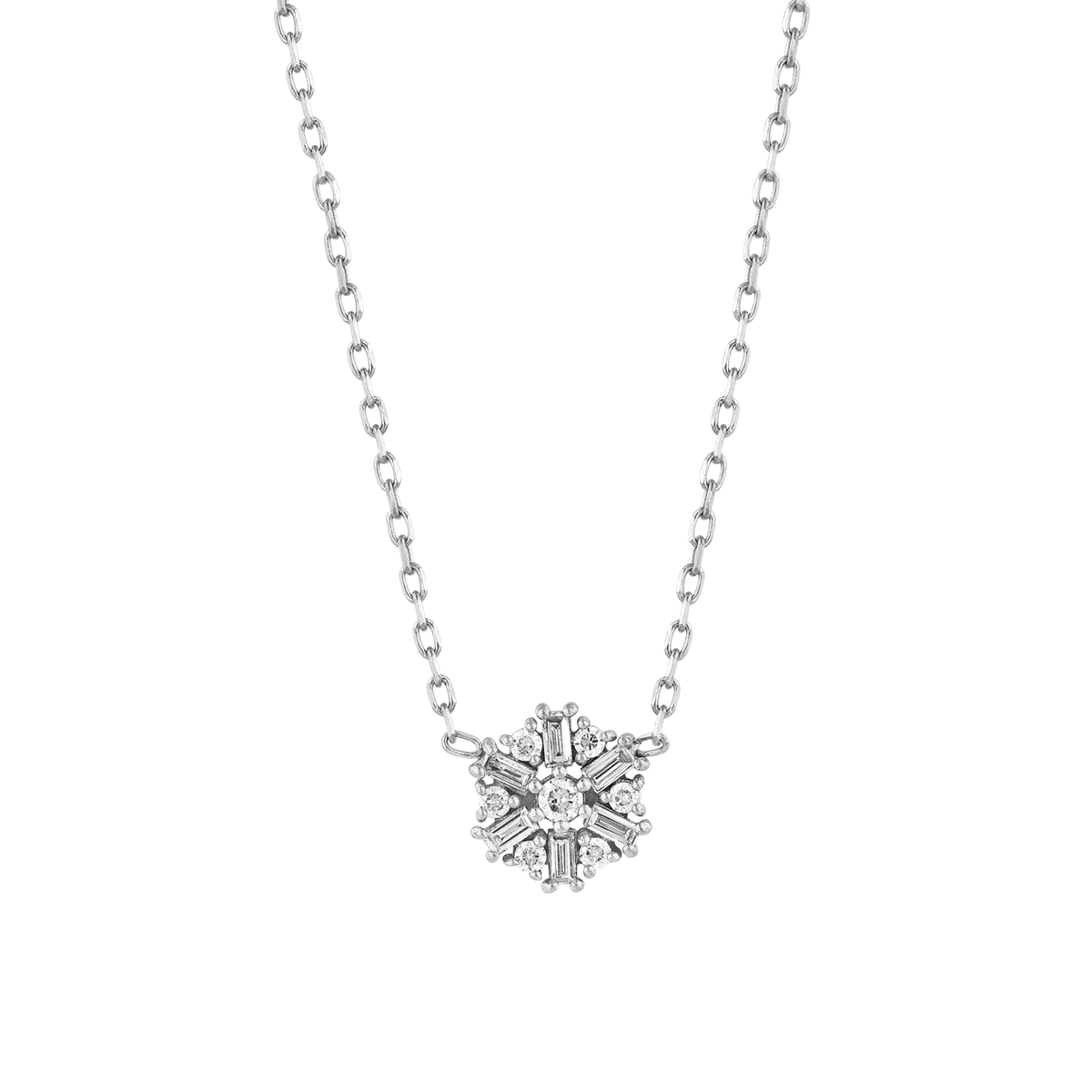 Close view of the snowflake motif: six baguette diamonds radiating around a central round brilliant in 14K white gold