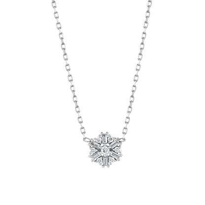 Close view of the snowflake motif: six baguette diamonds radiating around a central round brilliant in 14K white gold