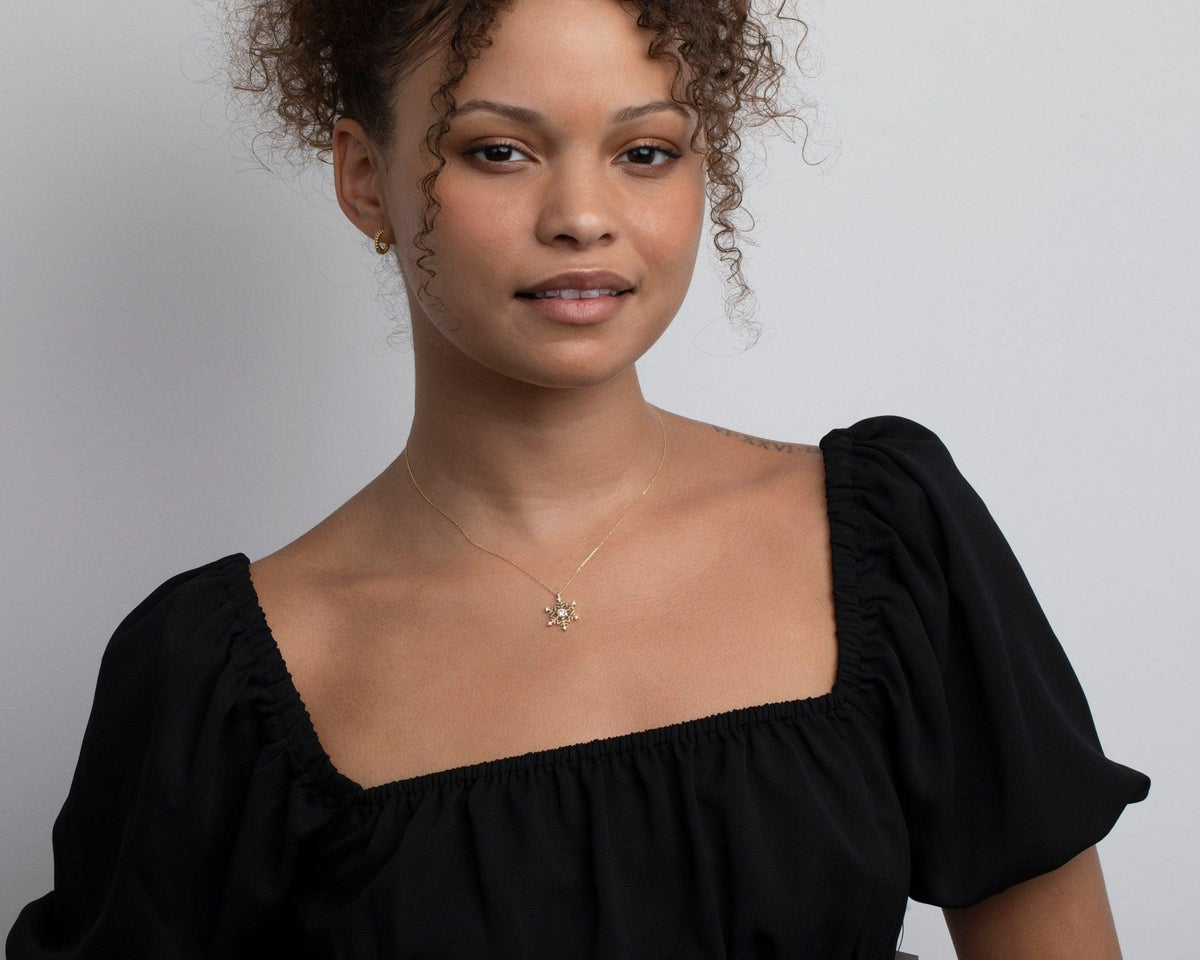 The Snowflake Pendant Necklace styled in 18K Gold Vermeil — elegant everyday jewelry. Hypoallergenic, no green marks.