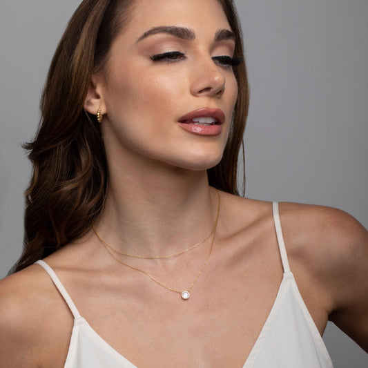 Close detail of the Solitaire Bezel CZ Diamond Necklace in 18K Gold Vermeil with CZ Diamond. Hypoallergenic, no green.
