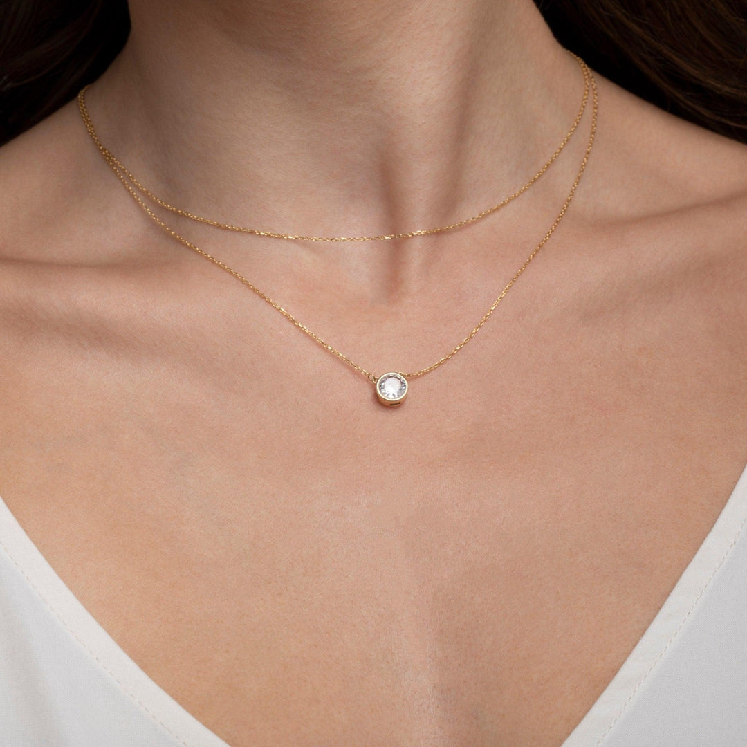The Solitaire Bezel CZ Diamond Necklace styled in 18K Gold Vermeil — elegant everyday jewelry. Tarnish-resistant.