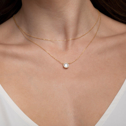 The Solitaire Bezel CZ Diamond Necklace styled in 18K Gold Vermeil — elegant everyday jewelry. Tarnish-resistant.