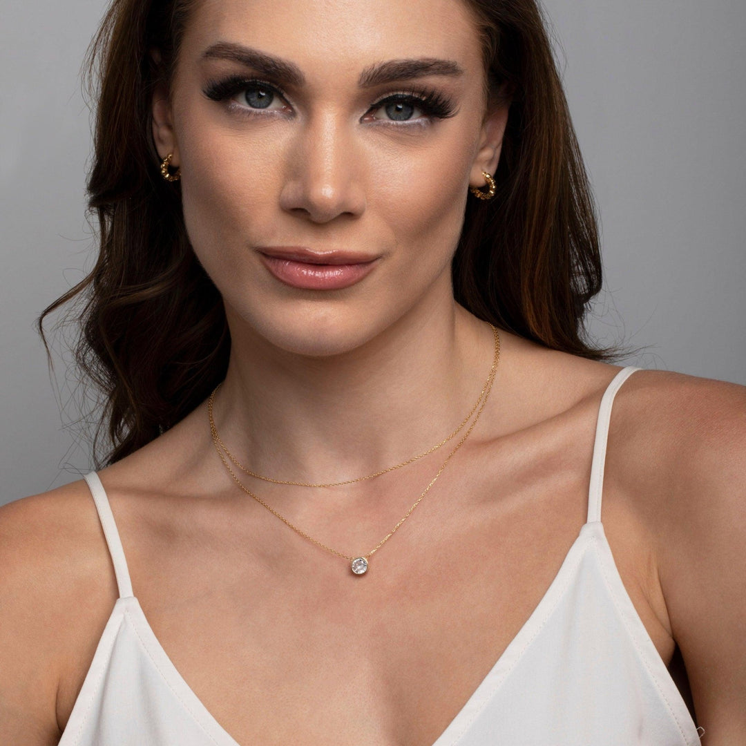 The Solitaire Bezel CZ Diamond Necklace as an anniversary gift in 18K Gold Vermeil. Tarnish-resistant, made for keeping.