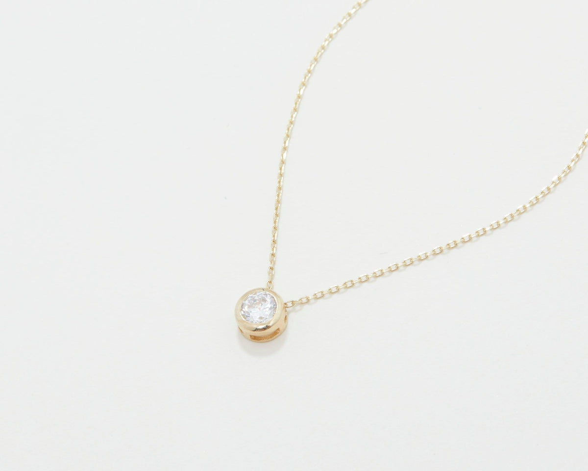 The Solitaire Pendant Necklace styled in 18K Gold Vermeil — elegant everyday jewelry. Tarnish-resistant.